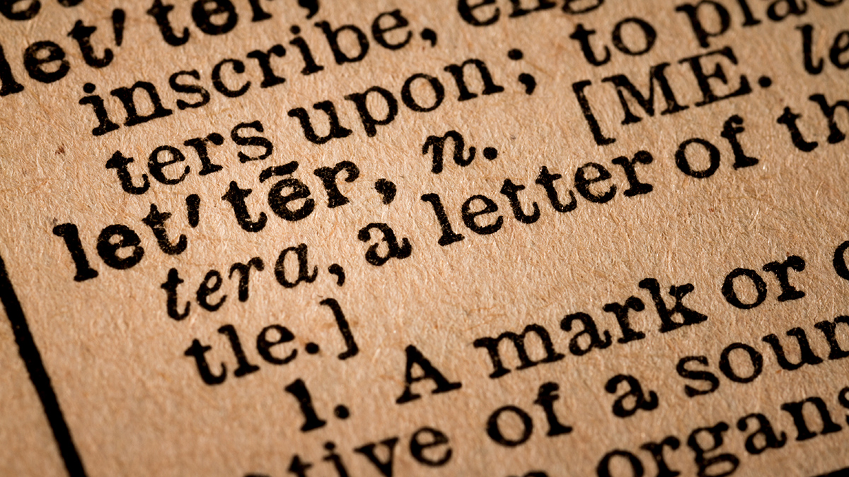 Close-up of an Opened Dictionary showing the Word LETTER